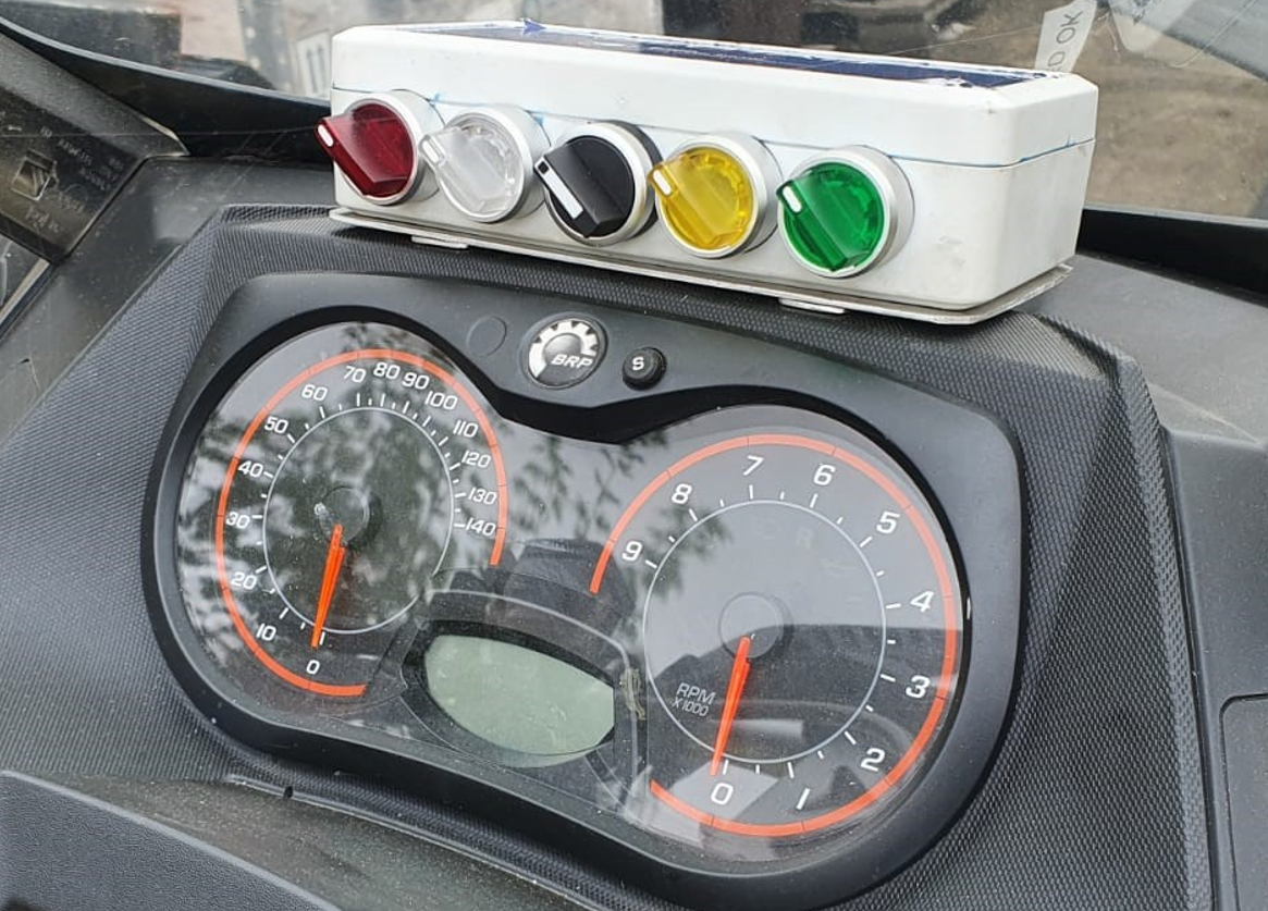Different coloured switches on snowmobile
